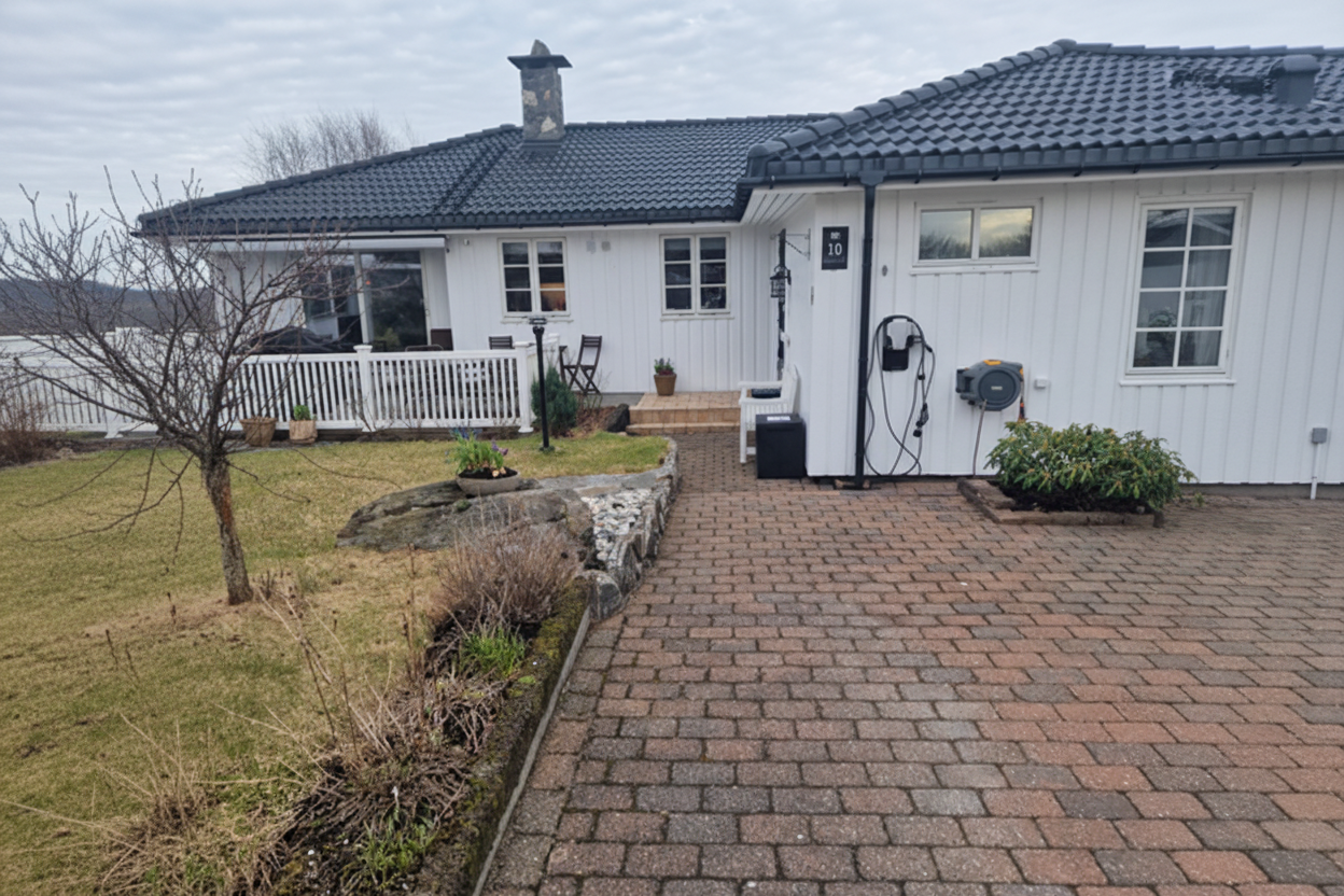 Hus med hentekasse beskjært